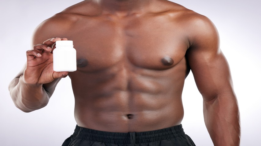 A men holding OAD Men Bottle Symbolizing it as a best Multivitamins for Men In Pakistan